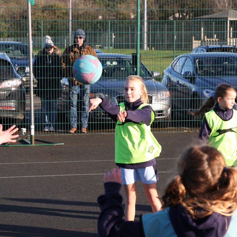 girl throwing a ball