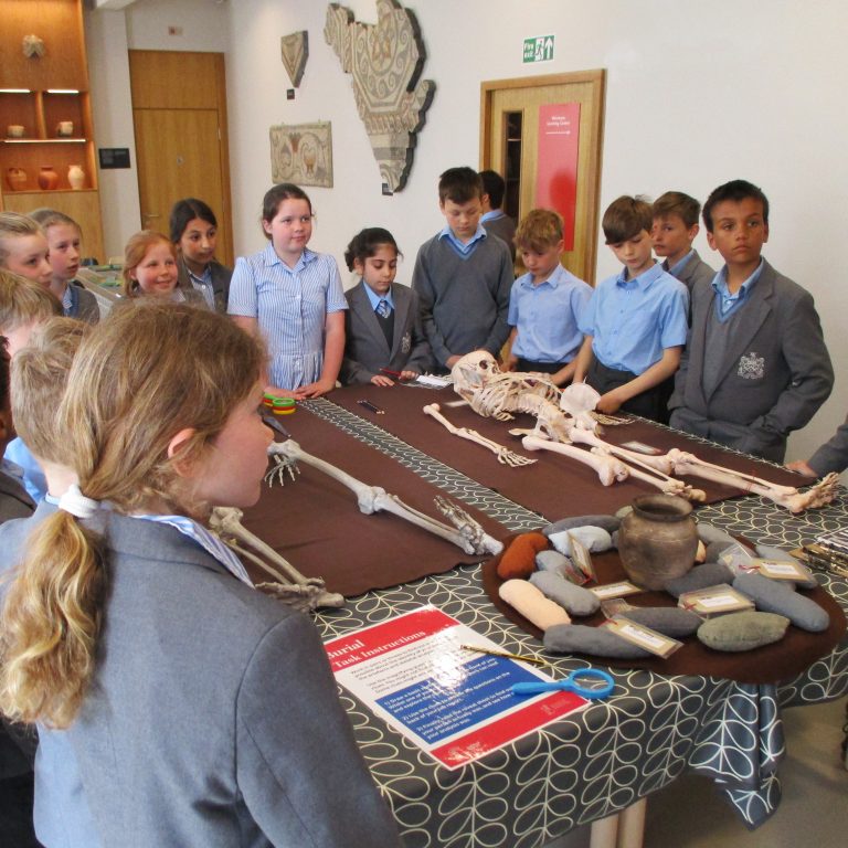 students surrounding a table