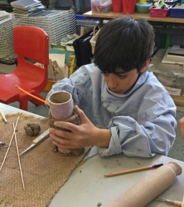 student using clay