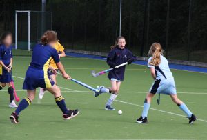 students playing a game of hockey