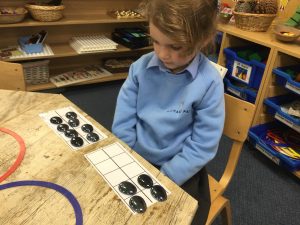 girl with counters in front of her