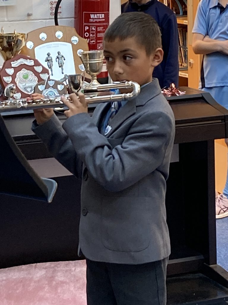 boy playing an instrument