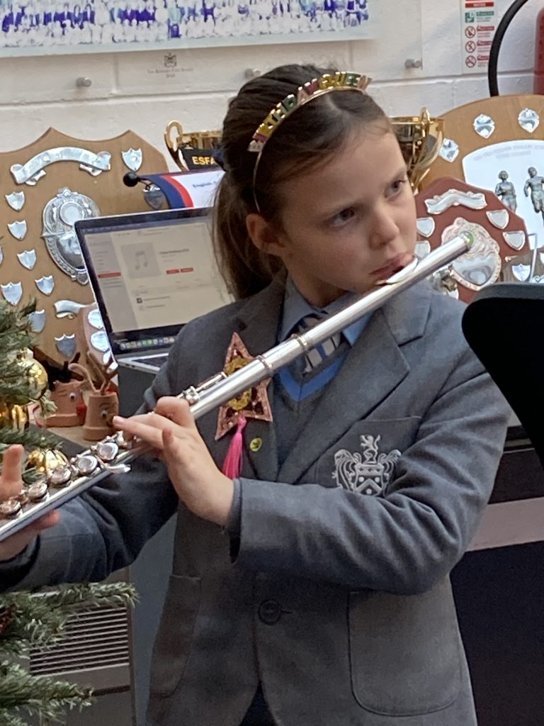 girl playing a flute