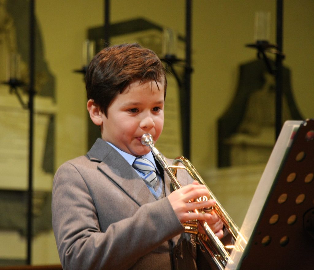 boy playing the trumpet