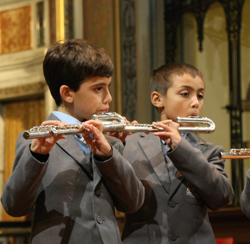 boys playing the flute