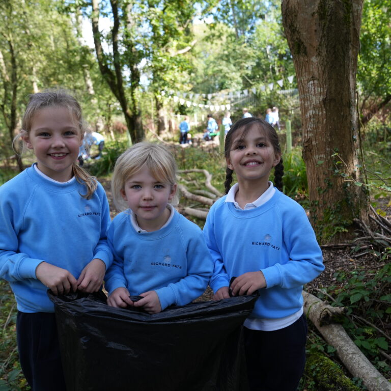 students collecting litter